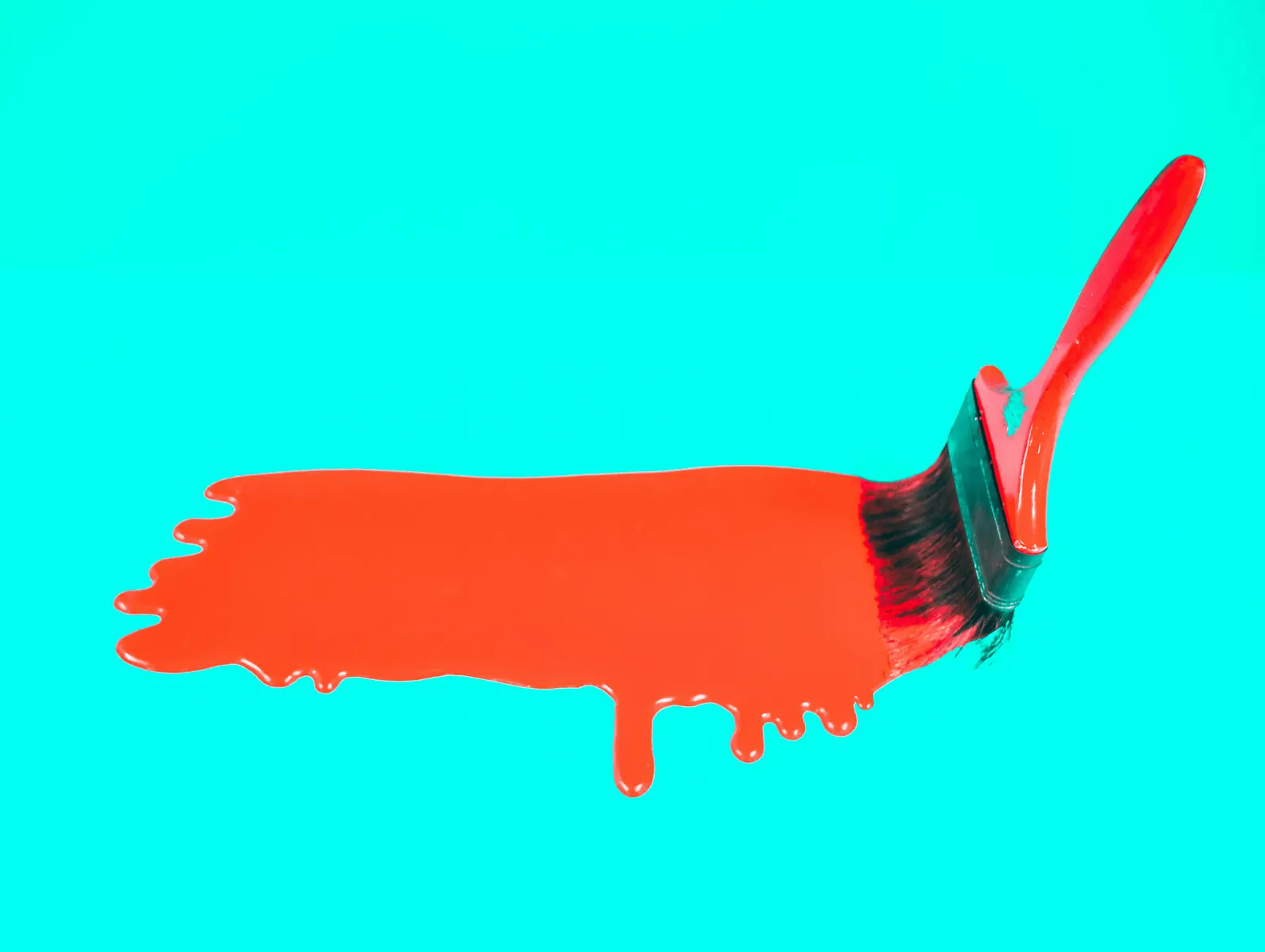 Red paint brushed across a bright aqua surface, with drips along the lower edge